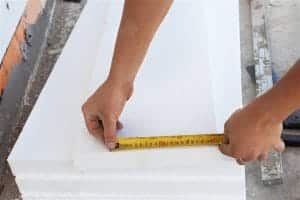 Boise Home Inspector man measuring a wood