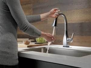 Boise Home Inspectors woman washing her hands in the faucet