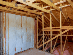 Attic framing and insulation in a Boise, ID home being inspected.