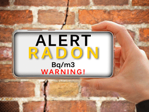 Radon alert displayed on phone screen with warning message, showing Bq/m3 units.